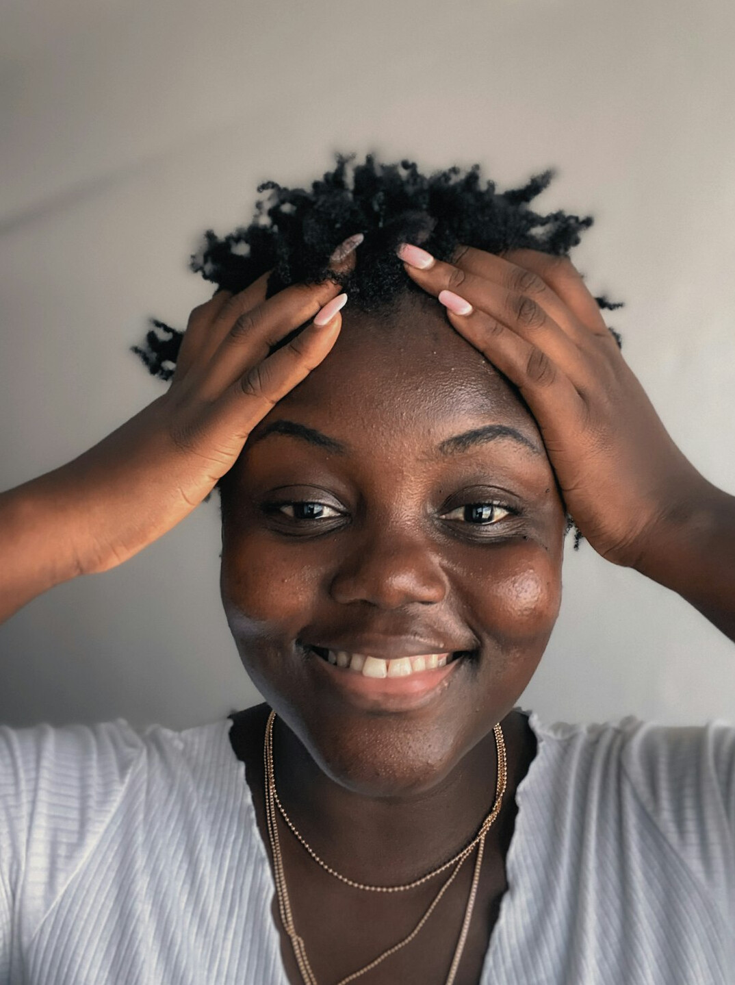Portrait of a Black woman with a confident smile
