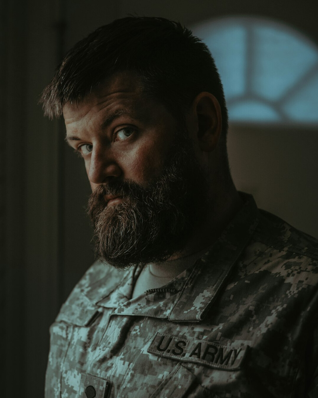 Portrait of a bearded man looking at the camera