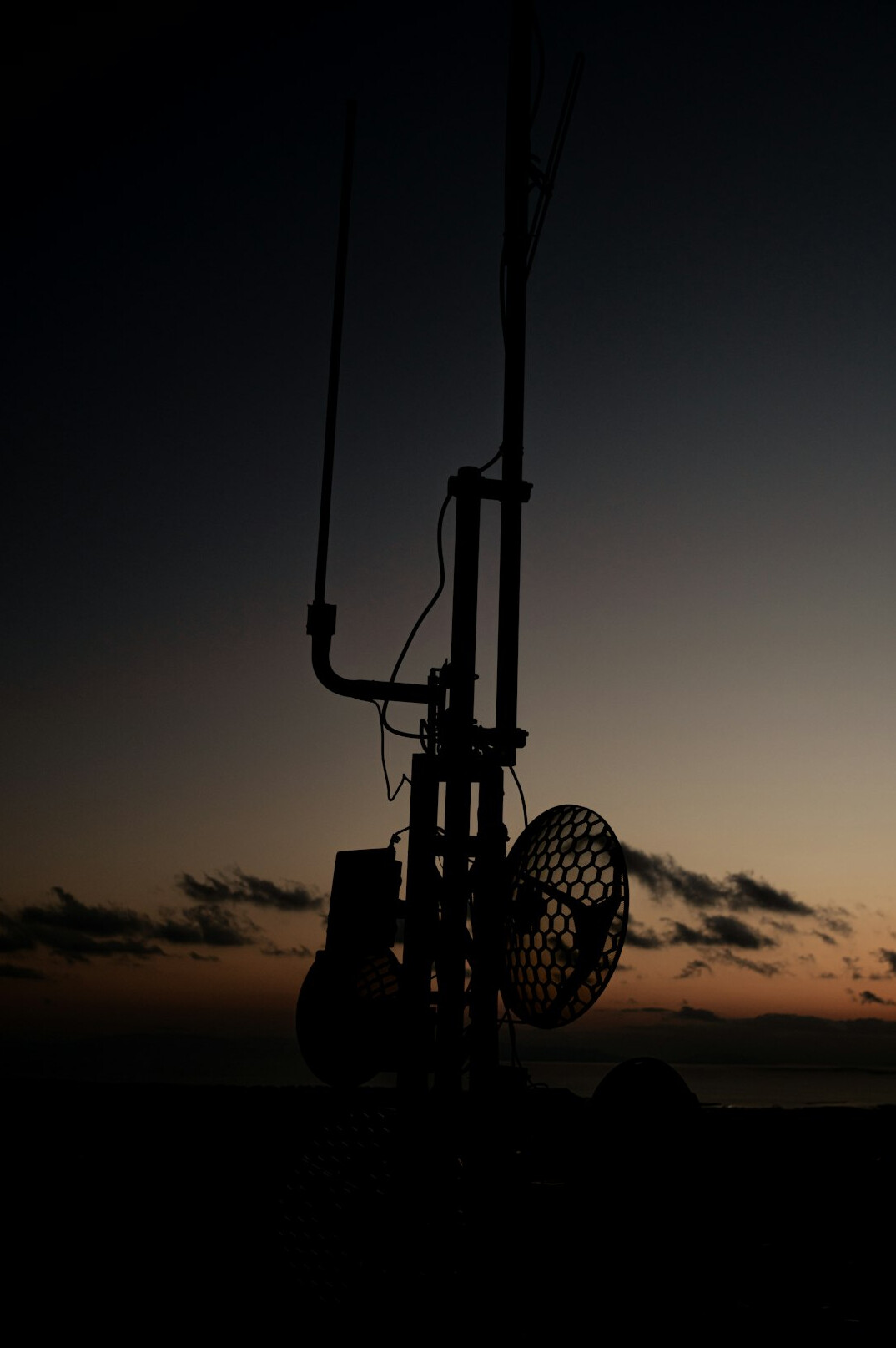 Cinema style camera on a rig outdoors at dusk